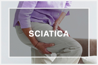 woman holding leg pain sciatica