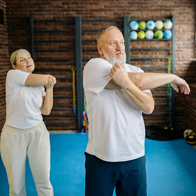 Chiropractic-Senior-Couple-Stretching-Out-640x640-HP-Moto.webp
