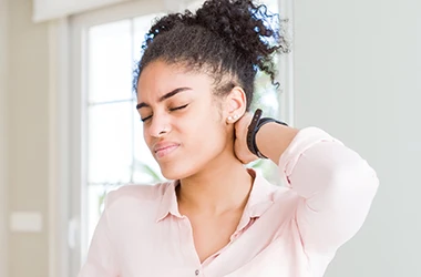 Woman-With-Neck-Pain-Symptom-Drop-2.webp