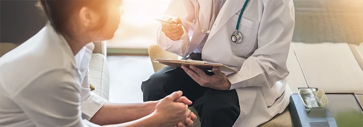 Doctor consulting patient on chronic illness relief using functional medicine approach Doctor consulting patient on chronic illness relief using functional medicine approach
