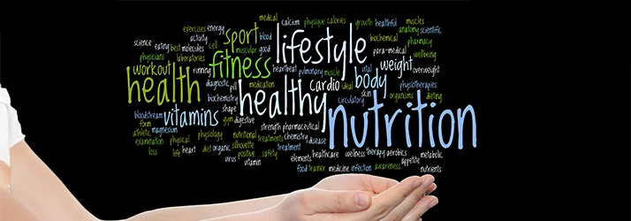 Hand holding nutrition and wellness keywords representing functional medicine nutritional care