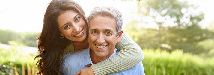 Smiling couple enjoying wellness after functional medicine treatment