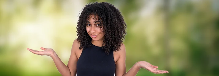 Woman gesturing uncertainty representing common functional medicine questions